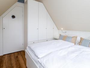Ein Bett oder Betten in einem Zimmer der Unterkunft Sylt Leif