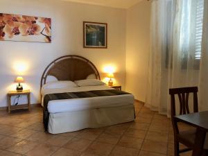מיטה או מיטות בחדר ב-Casale Calavita