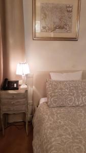 A bed or beds in a room at Mulino dell'Abbazia Country Resort