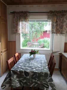 a dining room with a table and a window at RBA RentHouse Apartment 3 in Nedervetil