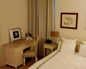 A bed or beds in a room at Mulino dell'Abbazia Country Resort