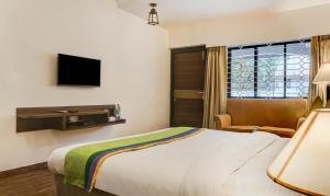 Treebo Five Elements, Lonavala客房内的一张或多张床位