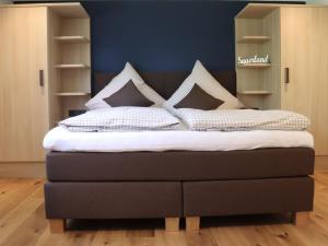 Säng eller sängar i ett rum på Rübenkämpers Ferienwohnungen