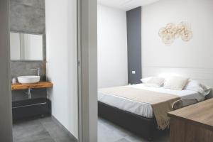 
A bed or beds in a room at Le Dimore del Borgo - Room & Breakfast
