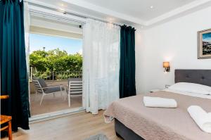 Posteľ alebo postele v izbe v ubytovaní Apartments El Corsaro
