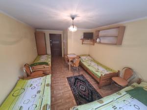 Postel nebo postele na pokoji v ubytování Kryniczanka