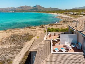 a view of the beach from the roof of a house at Apartment Jedy Balear By homevillas360 in Son Serra de Marina