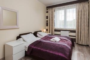 Posteľ alebo postele v izbe v ubytovaní Gdańsk Comfort Apartaments Łąkowa