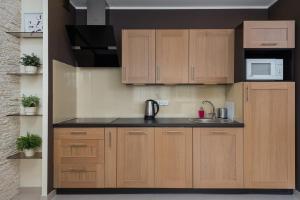 Kuchyňa alebo kuchynka v ubytovaní Gdańsk Comfort Apartaments Łąkowa