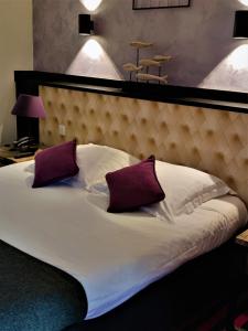 Postelja oz. postelje v sobi nastanitve Hostellerie du Val d'Or