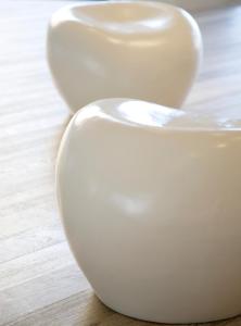 two white vases sitting on top of a wooden floor at Sandy Beach Hotel & Spa - ex Sentido in Larnaca
