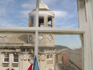 a view of a building with a clock tower from a window at Regent House in Scarborough