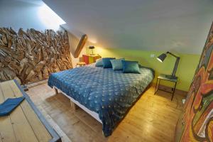 Postel nebo postele na pokoji v ubytování Gîte - L'atelier au 19