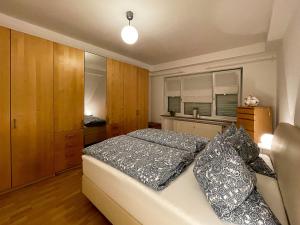 a bedroom with a bed with pillows on it at Ferienwohnung im Eisenbergweg in Bad Mergentheim