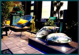 two pillows sitting on a bench in a store at The Lodge A'PART in Néewiller-près-Lauterbourg