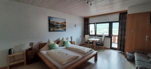 Postel nebo postele na pokoji v ubytování Alpenappartements Schwalbennestl