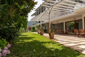 an external view of a house with a patio at Milies Apartments in Stavros