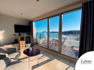 a living room with a view of the ocean at La Sort Boutique Hotel in Moraira