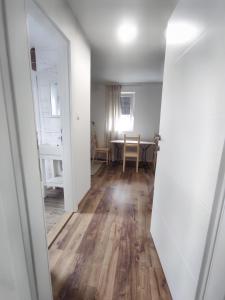an open door to a living room with a table at Aria Plitvice in Plitvička Jezera +46 photos