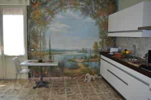 Kuchyň nebo kuchyňský kout v ubytování Riflessi d'Arte
