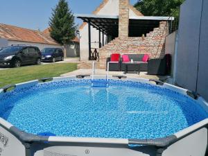 a large plunge pool in the backyard of a house at Apartmány 77 in Veľký Meder