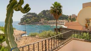 a view of the ocean from a balcony at Villaggio Placido in Taormina