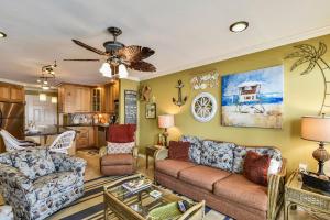 a living room with a couch and a table at Seascape 1209 Condo in Galveston