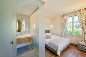Hotel Eden Spiez客房内的一张或多张床位