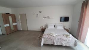 Postel nebo postele na pokoji v ubytování Batkoski Apartments