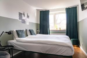 Postel nebo postele na pokoji v ubytování Botanika Uppsala + 37 fotografií