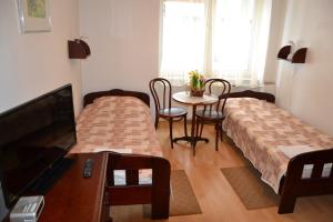 Łóżko lub łóżka w pokoju w obiekcie Hotel Monttis