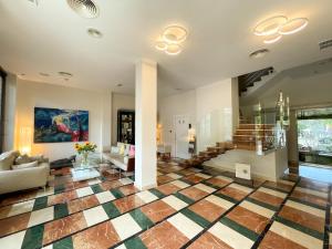 a living room with a checkered floor at La Sort Boutique Hotel in Moraira