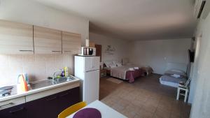 Postel nebo postele na pokoji v ubytování Batkoski Apartments