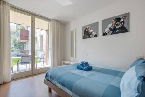 Ένα ή περισσότερα κρεβάτια σε δωμάτιο στο Easylife - Modern and Spacious apt in Fiera City Life