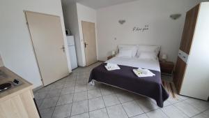 Postel nebo postele na pokoji v ubytování Batkoski Apartments