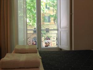 Postel nebo postele na pokoji v ubytování 2 Be Home Colosseo
