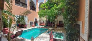 a swimming pool in the middle of a house at Riad Barroko in Marrakesh