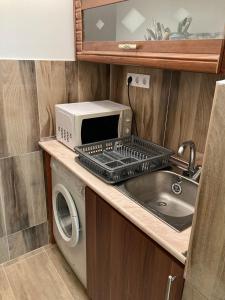 Kuchyňa alebo kuchynka v ubytovaní Roland Apartmant Zuglo