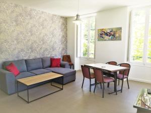 a living room with a couch and a table at ROYAL LUCHON in Luchon