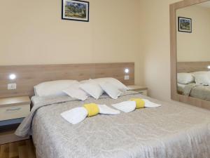 Postel nebo postele na pokoji v ubytování Apartment Baba Nevenka by Interhome