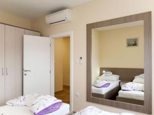 Postel nebo postele na pokoji v ubytování Apartment Baba Nevenka by Interhome