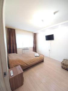 Apartament Predmeste房間的床