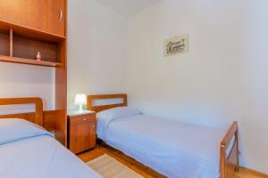 Postel nebo postele na pokoji v ubytování Soba Cres