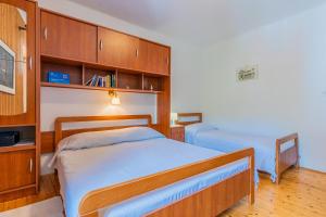 Postel nebo postele na pokoji v ubytování Soba Cres