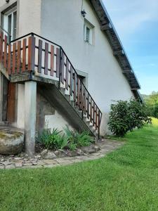 a staircase on the side of a house at GITE LE PETIT SAUCELEY in Faymont