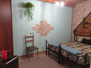 A bed or beds in a room at Stanza Del Viggiatore
