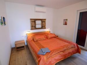Posteľ alebo postele v izbe v ubytovaní Apartment Viva-by the sea-garden & terraces by Interhome