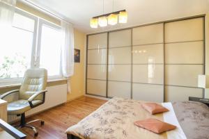 Posteľ alebo postele v izbe v ubytovaní Apartamenty Haffnera by Grand Apartments