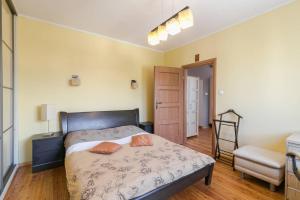 Posteľ alebo postele v izbe v ubytovaní Apartamenty Haffnera by Grand Apartments