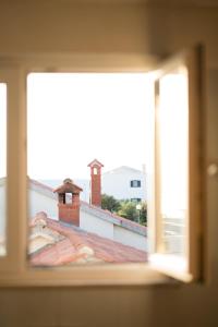 Una televisión o centro de entretenimiento en Apartman Mimi